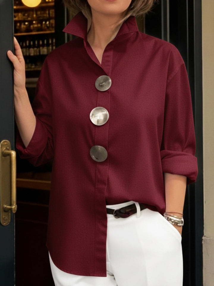 Professional women's elegant blouse with distinctive big buttons, suitable for office and events.