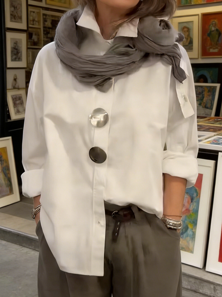 Classic women's button-front blouse, updated with a modern collar for an elegant daily look.