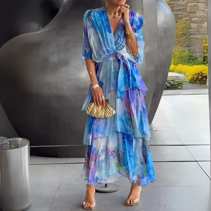 Elegant women's blue draped cocktail dress. Perfect for evening events, parties, and formal occasions. Sophisticated style.