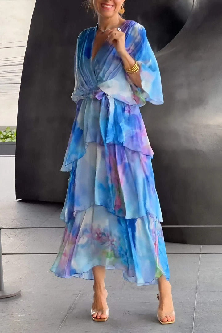 Stunning blue draped cocktail dress for women. Figure-flattering elegant evening wear, ideal for parties and events.