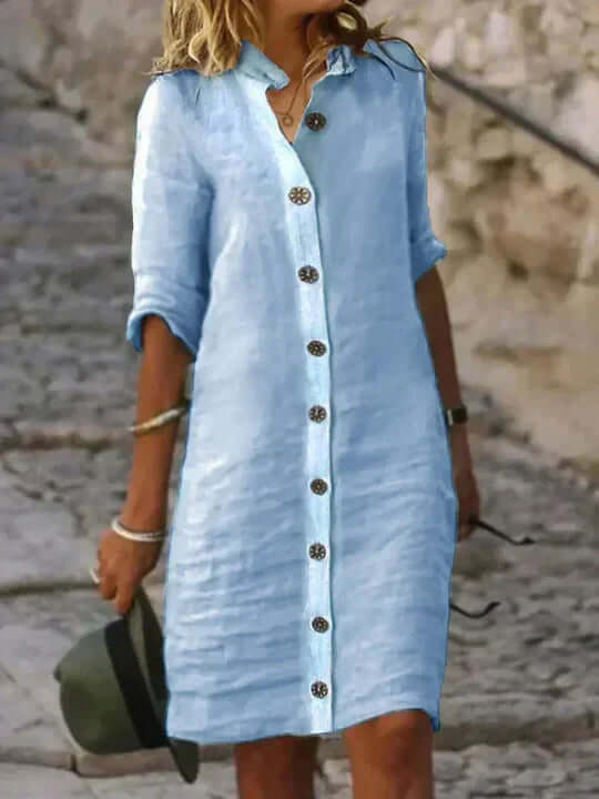 Elegant women's blue dress with a feminine silhouette, perfect for spring/summer fashion. Comfortable and chic.