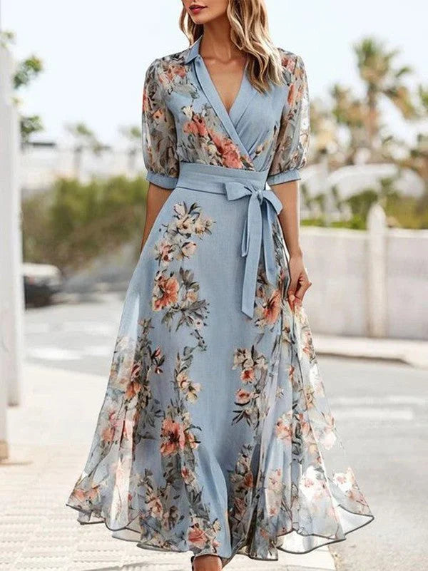 Elegant women's blue floral midi dress with V-neck, tie-waist, and chic puff sleeves for spring & summer fashion.