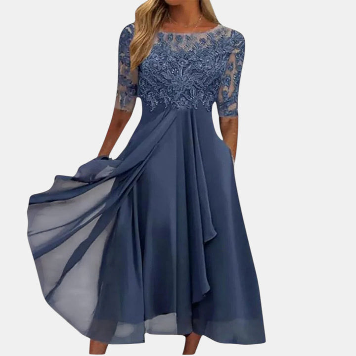 Elegant women's blue lace-inspired occasion dress, perfect for evening events & parties. Flattering, formal wear.