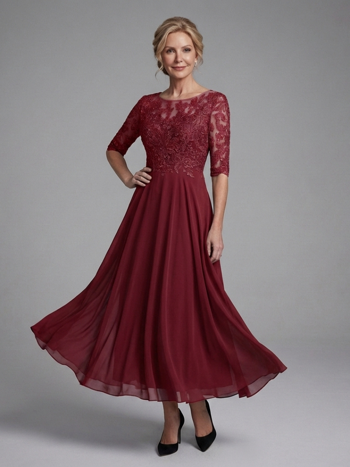 Stunning women's party dress with a beautiful lace bodice and sheer sleeves, offering an elegant midi look.