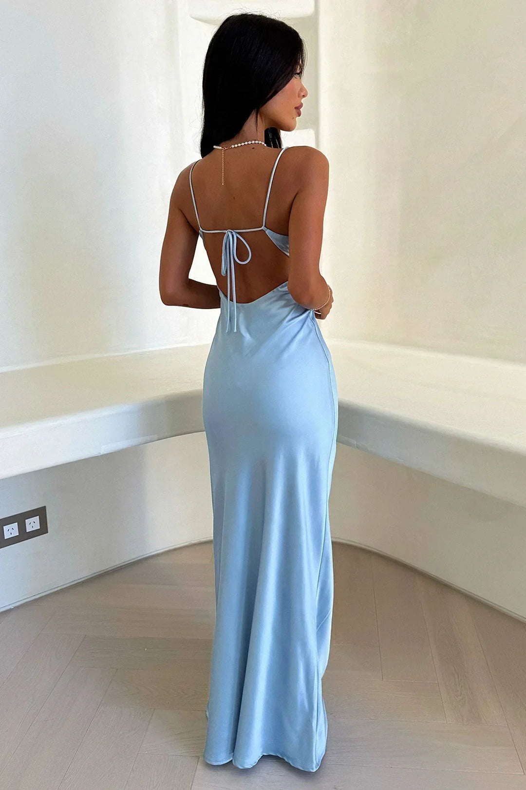 Formal women's V-neck blue maxi dress. Elegant evening gown perfect for wedding guests & sophisticated occasions.