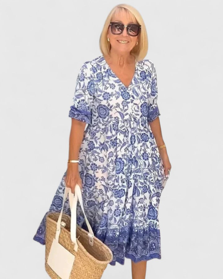 Elegant women's blue v-neck midi dress with half sleeves. Effortless & flattering design for summer occasions.