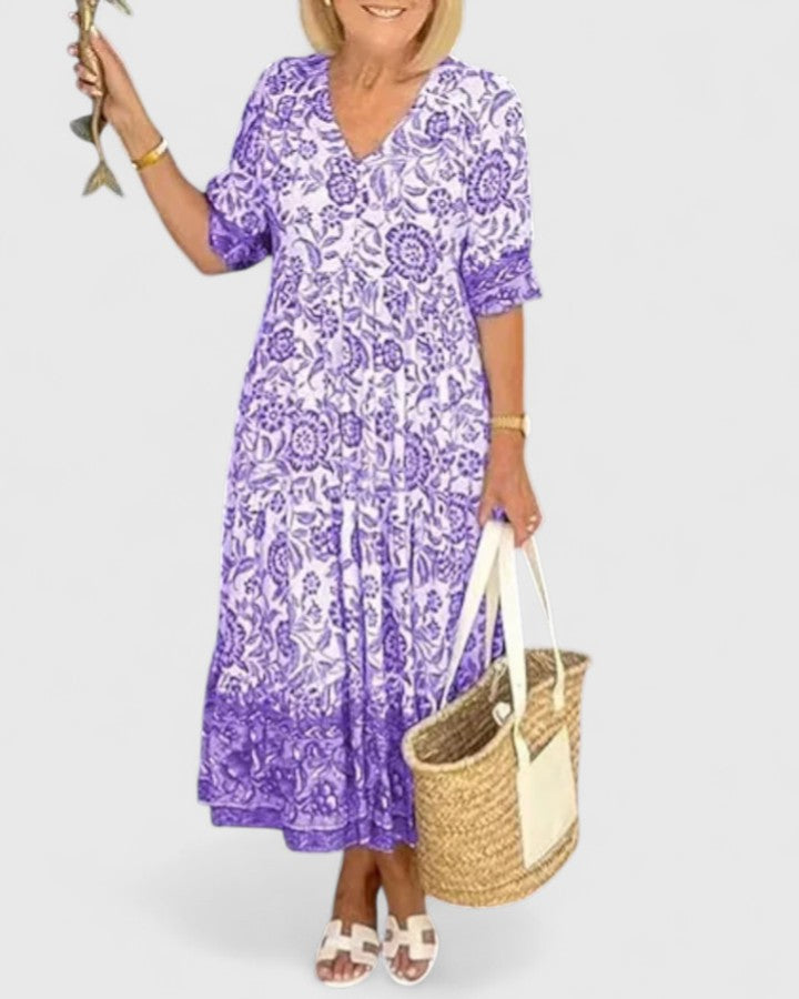 Effortless women's purple v-neck midi dress. Elegant half-sleeve design, perfect flattering fit for any occasion.