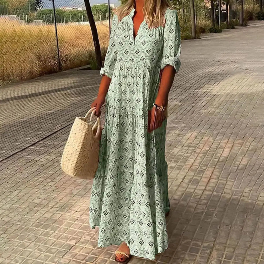 V-neck floral print maxi dress for women, featuring a bohemian style, tiered skirt, ideal for parties and occasions.