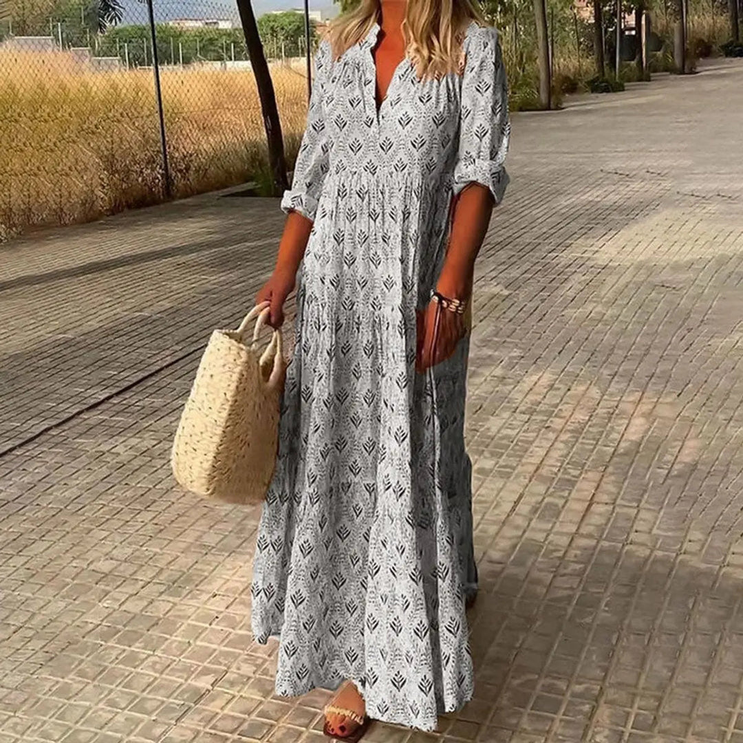 Stylish women's bohemian floral maxi dress with V-neck, a beautiful tiered cocktail party dress for any occasion.