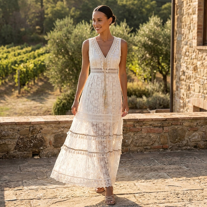Women's graceful beige boho maxi dress with V-neck, delicate lace, and a stylish tiered design. Perfect for summer.