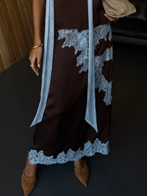 Rich brown women's lace panel halter top and flowing maxi skirt set. Elegant formal wear or sophisticated party outfit.
