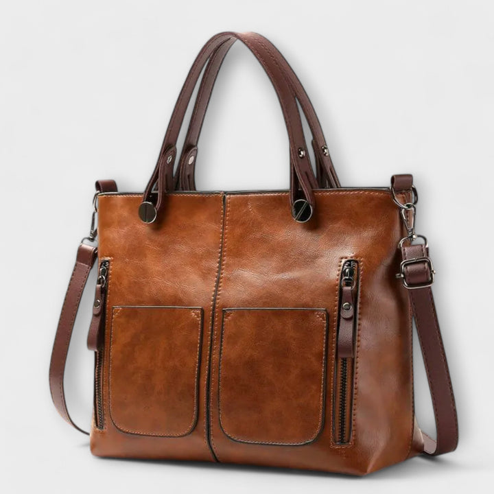 Elegant women's brown leather shoulder bag. Classic, versatile everyday fashion accessory.