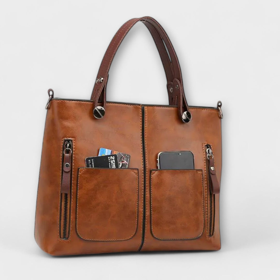 Classic grey leather shoulder bag for women. An elegant and versatile fashion accessory for any occasion.