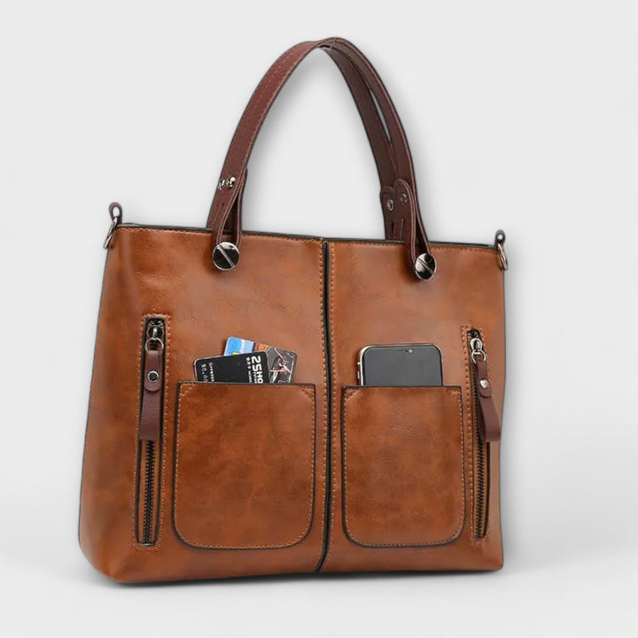 Classic grey leather shoulder bag for women. An elegant and versatile fashion accessory for any occasion.