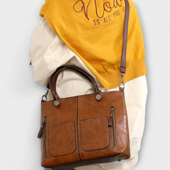 Elegant women's leather shoulder bag in a timeless style. Perfect work bag, travel companion, or daily accessory.