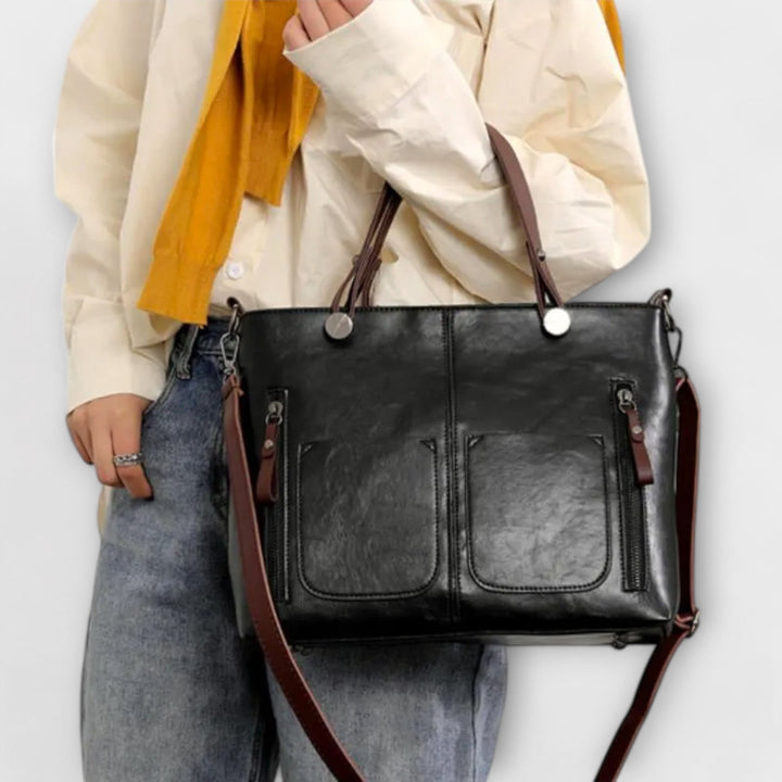 Stylish brown leather shoulder bag for women. A classic, elegant fashion accessory suitable for work or everyday.