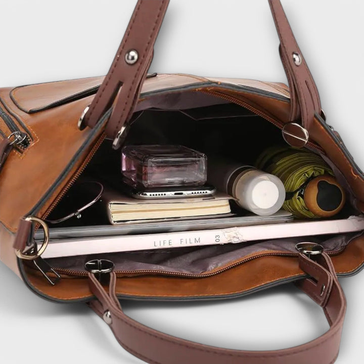 Chic grey leather shoulder bag for women. Elegant, versatile, and a perfect fashion accessory for office or leisure.