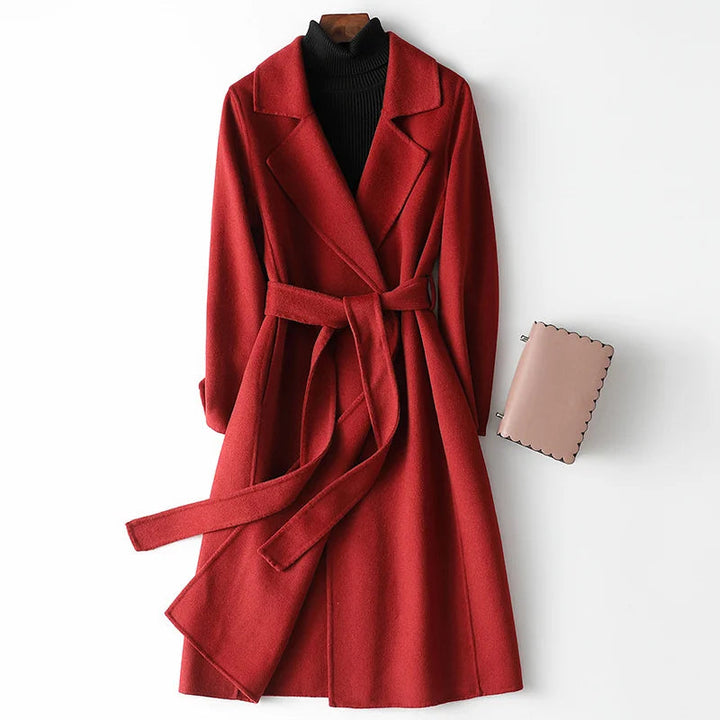 Elegant women's burgundy belted wrap coat, long A-line silhouette, perfect for chic winter fashion & sophisticated style.