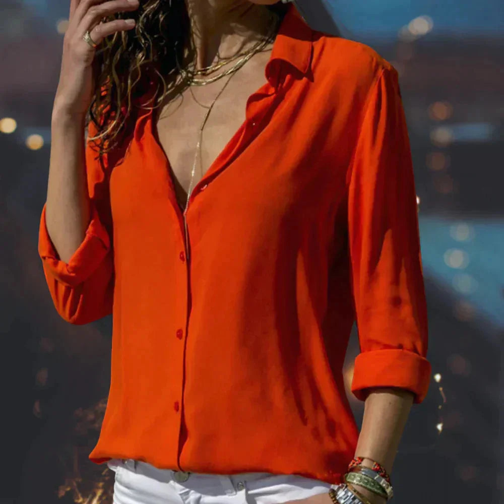 Stylish women's button-down blouse with modern flowing 3/4 sleeves, a versatile elegant top for spring fashion.