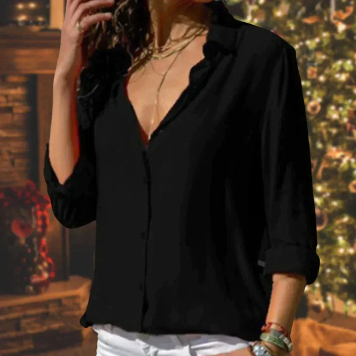 Versatile women's blouse with a flowing fit, elegant button-down front, and chic 3/4 sleeves for modern style.