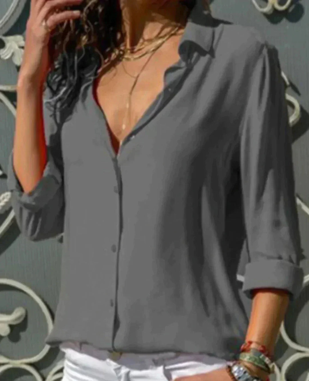 Modern women's elegant button-down blouse featuring flowing 3/4 sleeves, perfect for versatile work to casual looks.