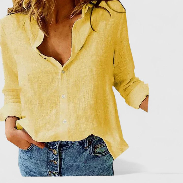 Relaxed fit long-sleeve women's blouse, button-down elegant top with lapel collar, ideal for casual fashion.