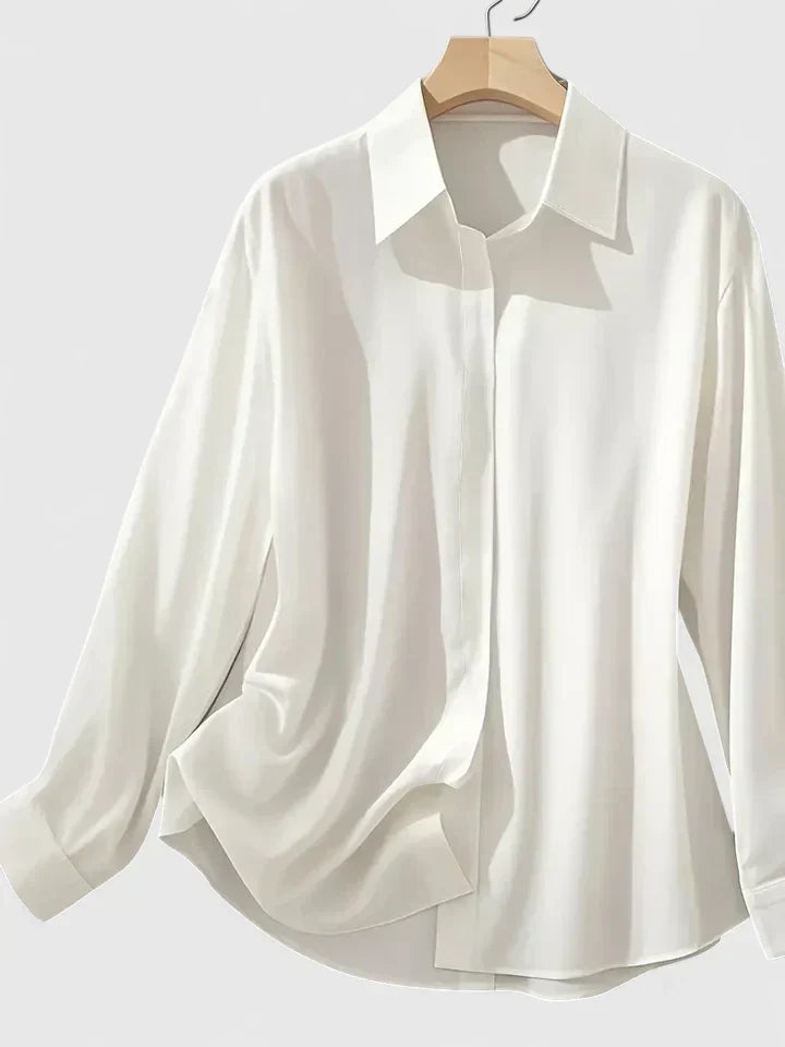 Elegant women's button-down top, perfect for office or casual chic. Versatile long sleeve blouse.