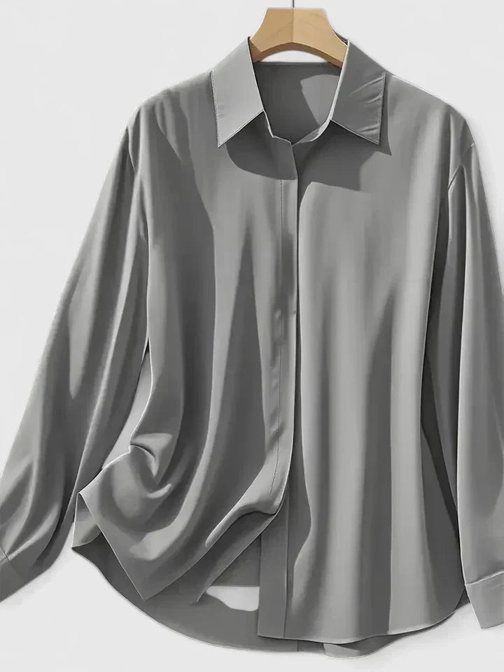 Stylish women's long sleeve button-down blouse, ideal for formal or everyday wear. Fashionable apparel.