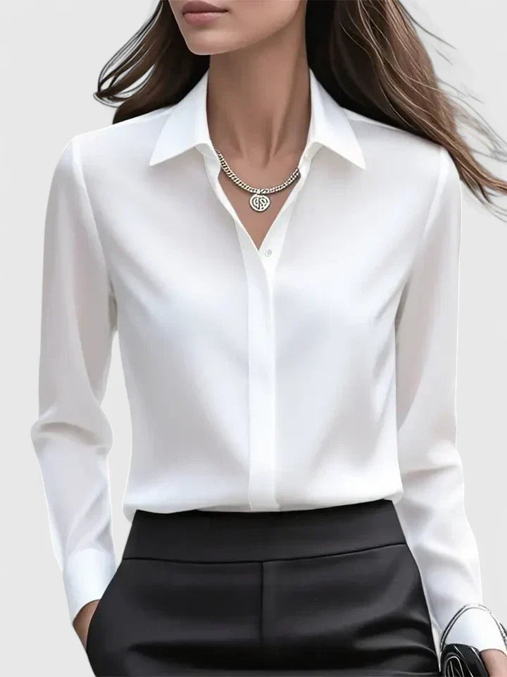 Fashionable women's versatile blouse with button-down front, suitable for any elegant occasion.