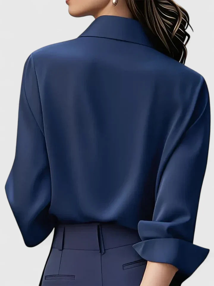 Elegant long sleeve women's top, button-down style for a polished, versatile look. Casual chic.