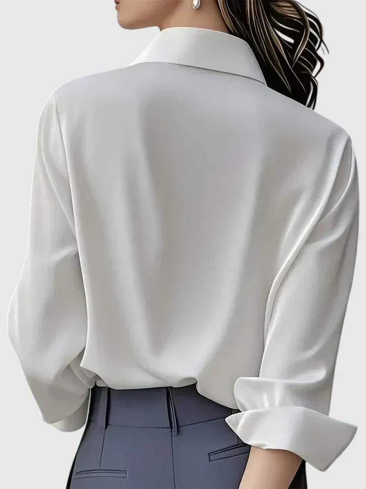 Sophisticated women's button-down blouse, long sleeve design for office, formal, or casual wear.