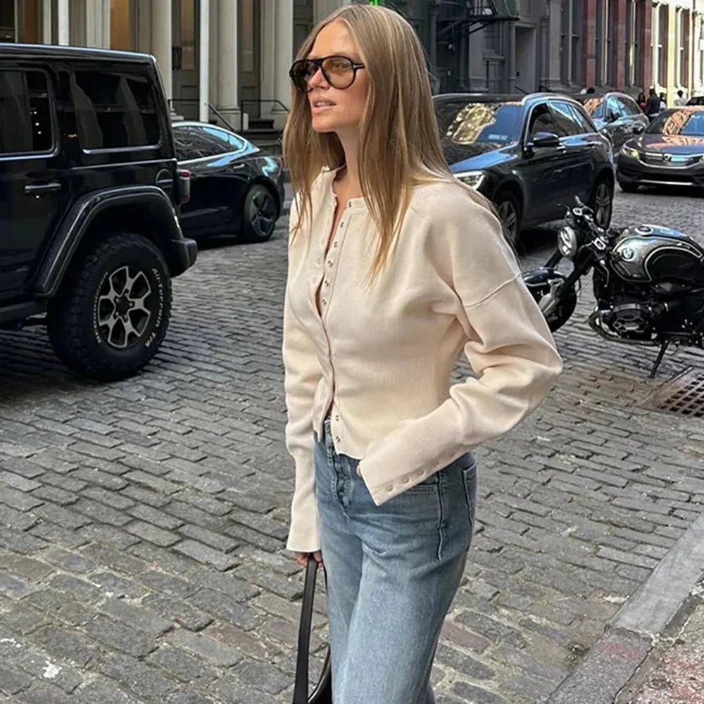 Classic long sleeve women's button-up cardigan with round neck, ideal as a versatile top & layering piece.