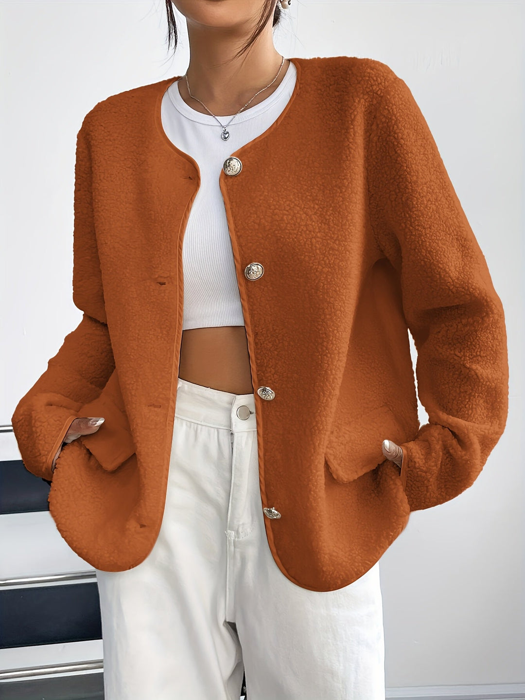 Elegant women's button-up jacket, perfect for fall and winter fashion.