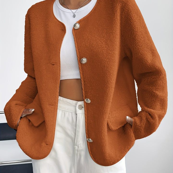 Chic ladies' knitted button-up jacket. Timeless design for autumn and winter comfort.