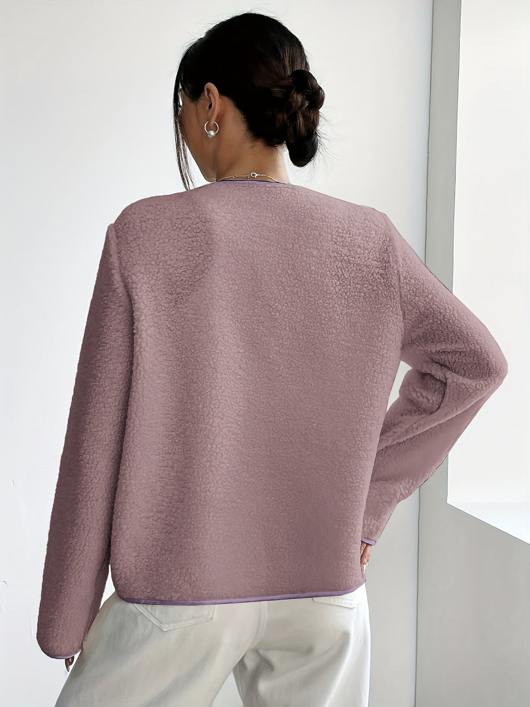 Timeless ladies' knitted jacket, soft and cozy for autumn & winter style.