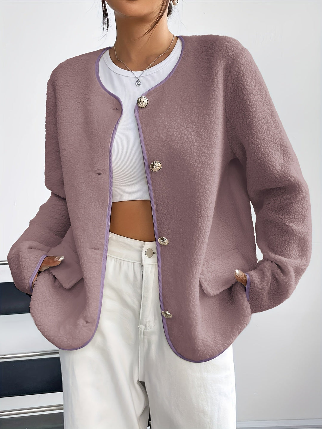 Soft knitted women's jacket with buttons, offering cozy elegance for winter.