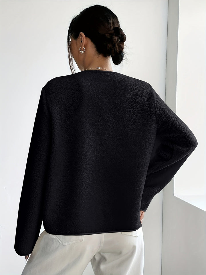 Ladies' elegant button-up jacket, a stylish wardrobe essential for cooler weather.