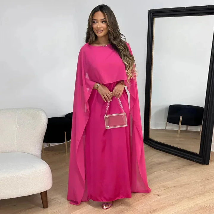 Chic women's formal cape maxi dress, ideal for wedding guests & special occasions. Elegant long evening gown.