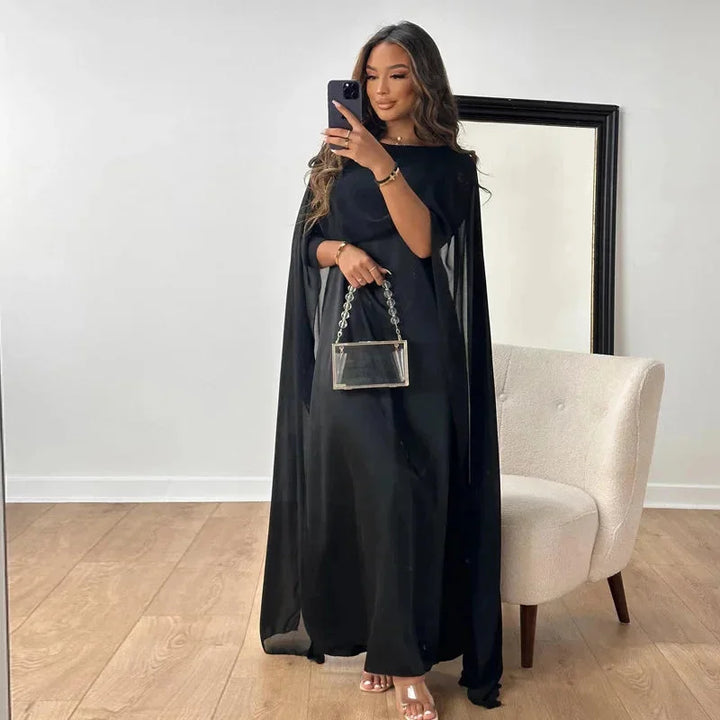 Beautiful women's elegant maxi dress with a cape, perfect for wedding guests, formal events, and evening wear.