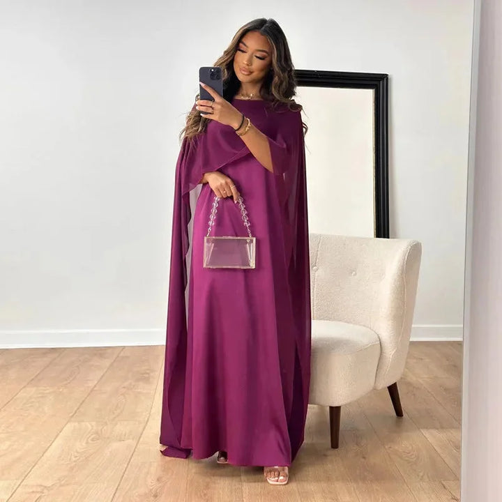 Stylish women's long cape maxi dress, an elegant formal gown ideal for wedding guests & special occasions.