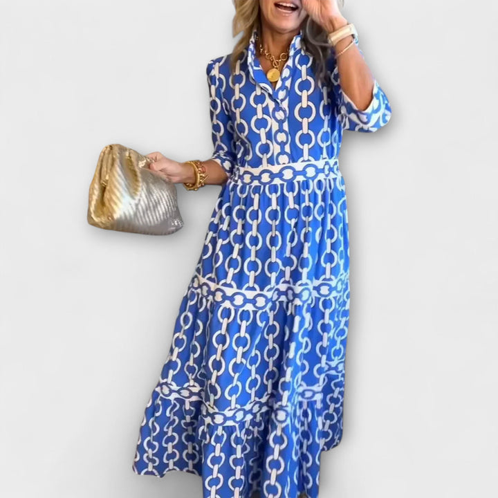 Elegant women's chain print midi dress with collared button-front style and three-quarter sleeves.