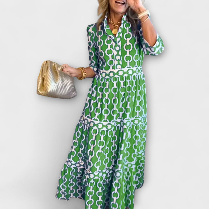 Stylish women's button-front midi dress, featuring an elegant chain print and flattering silhouette.