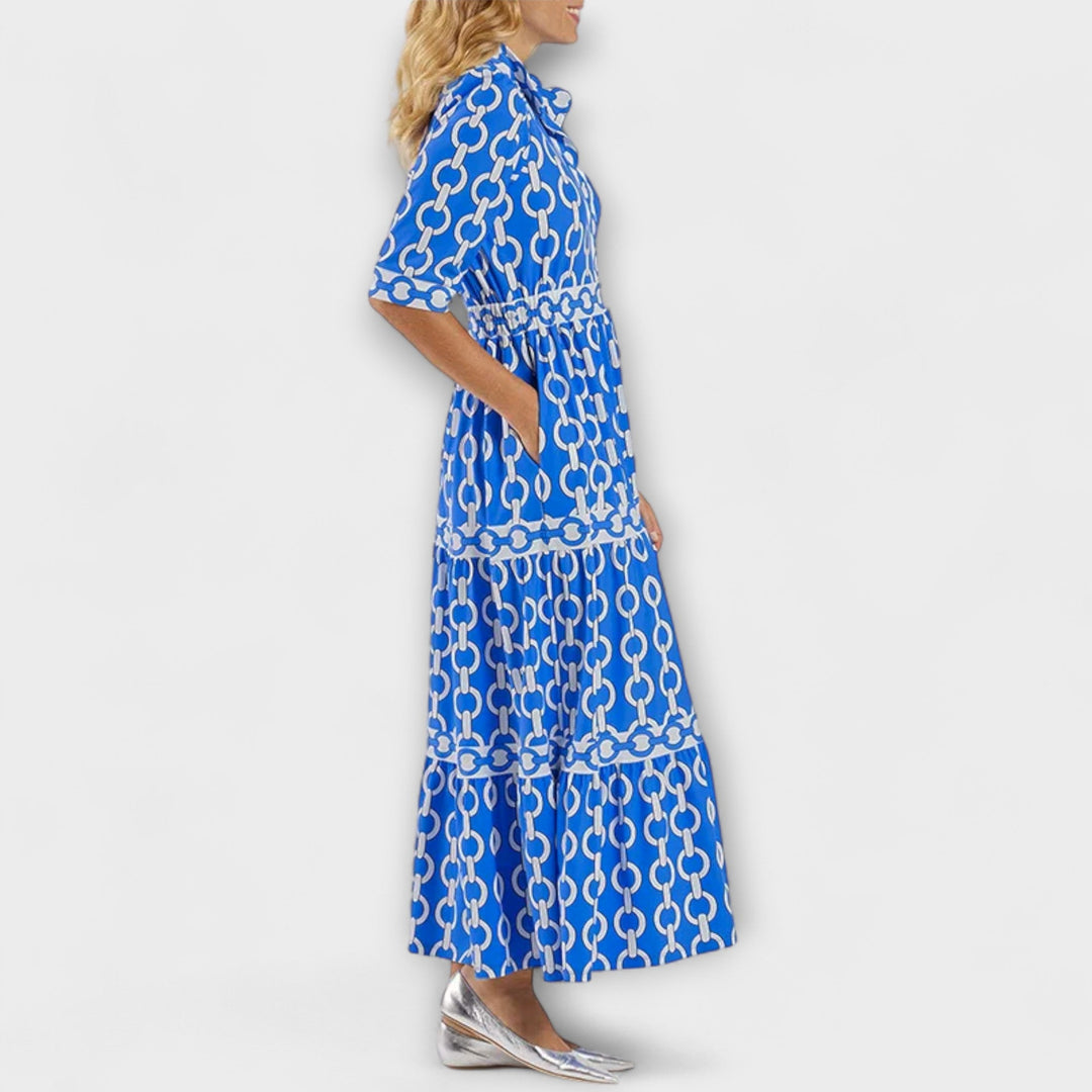 Statement women's chain print midi dress with elegant button-front design and flowing fabric.