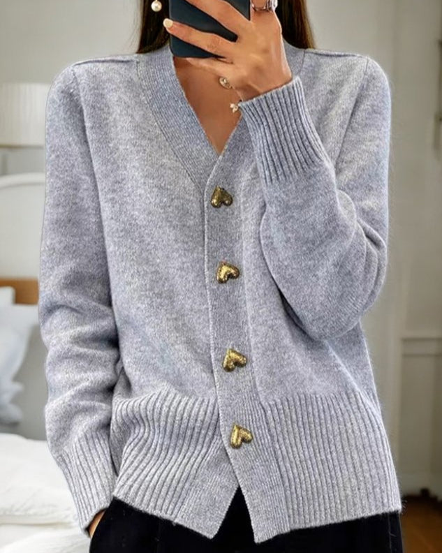 Elegant women's Chasie cardigan with heart buttons, a chic and cozy v-neck layer for stylish women.
