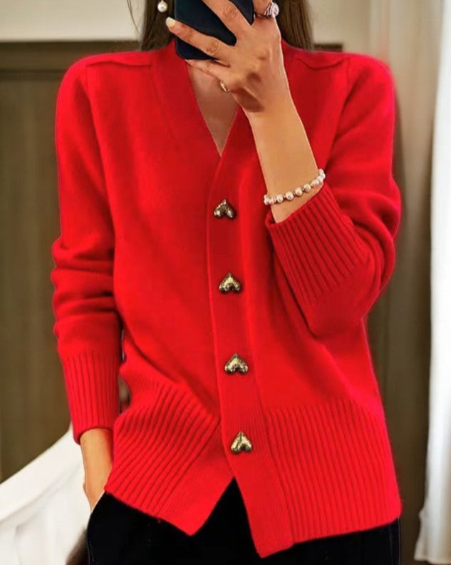 Chic women's v-neck cardigan with unique heart buttons, a cozy and elegant sweater for versatile styling.