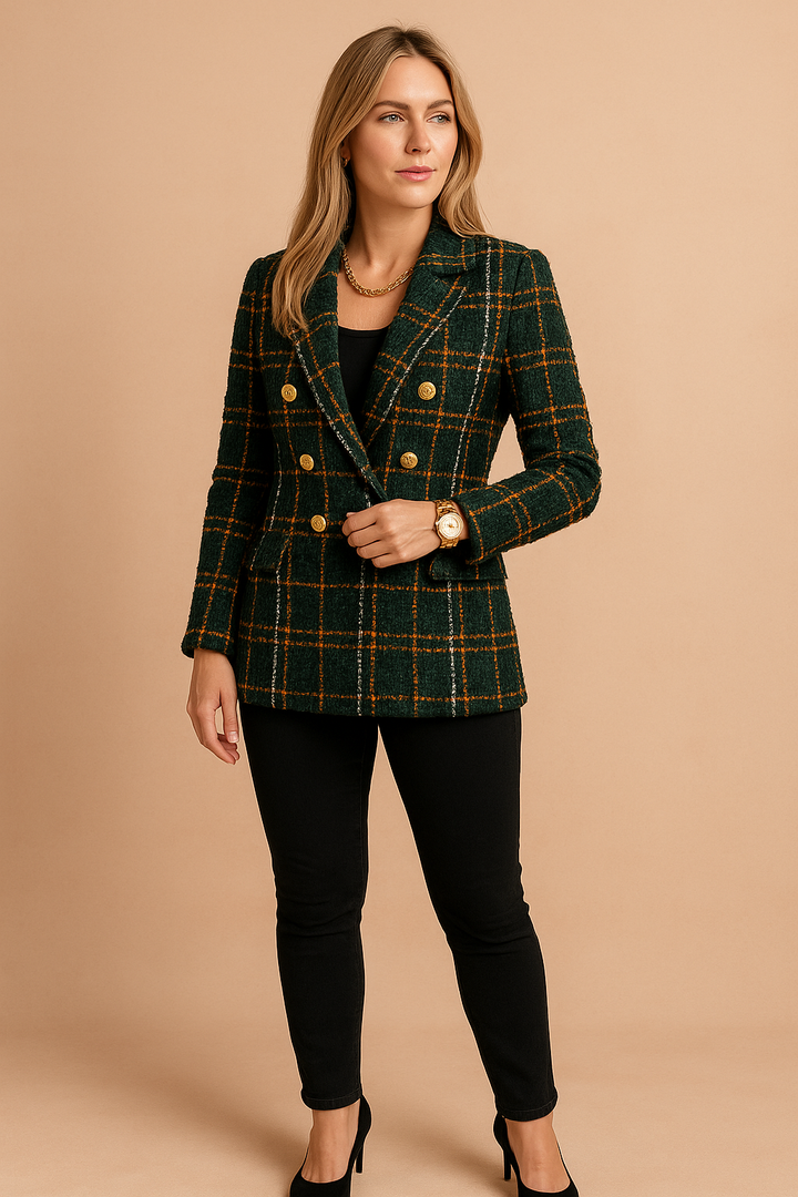 Close-up of women's checked blazer fabric, showcasing intricate weave and tailoring.