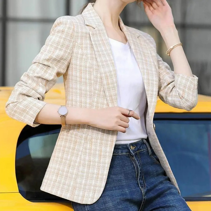Women's elegant single-button blazer in a chic checkered pattern, great for professional attire.