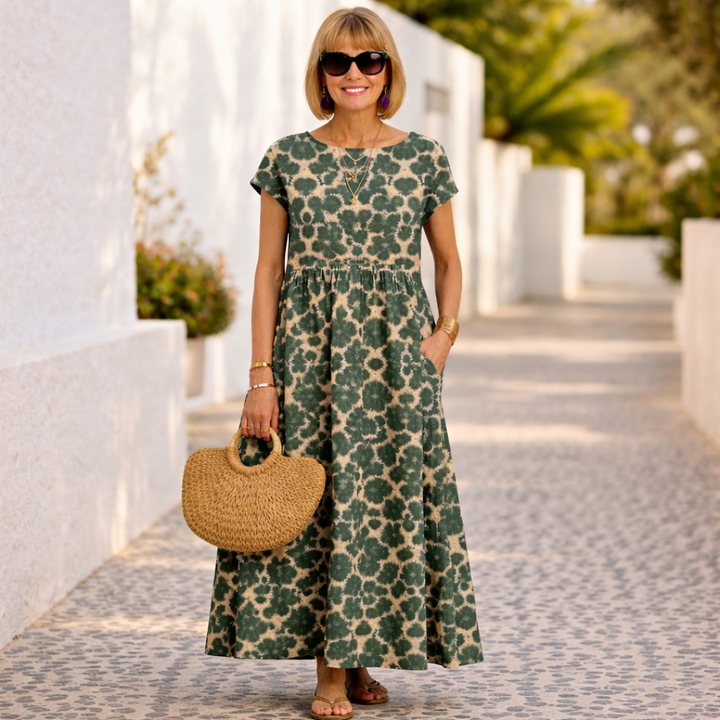 Back view of a women's elegant floral midi dress, showing its comfortable, flowy design perfect for summer.