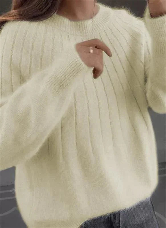 A cozy, warm women's sweater made from high-quality knitwear, a winter fashion essential.