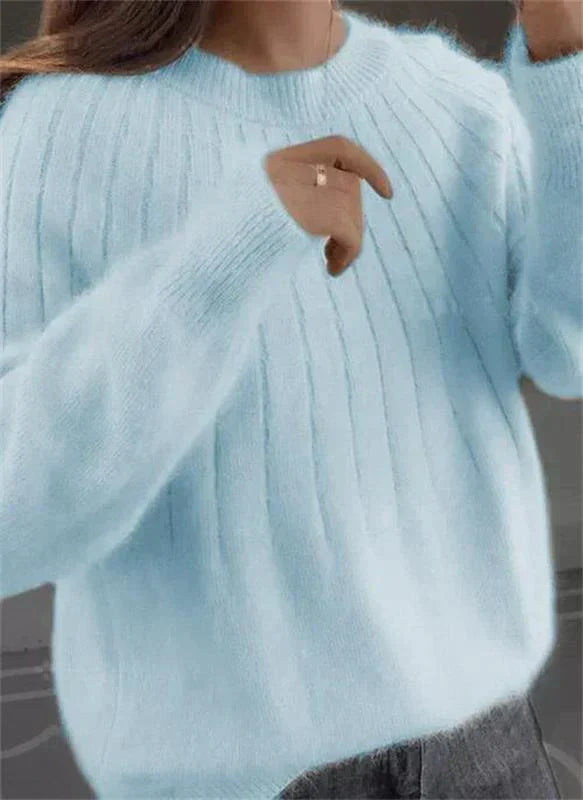 Effortlessly elegant women's knit sweater, ideal for layering in fall and winter.